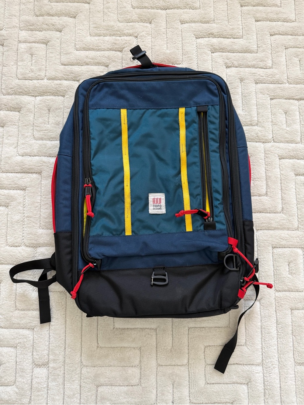 Topo Designs Navy, Teal & Yellow Men’s Backpack with Red Accents